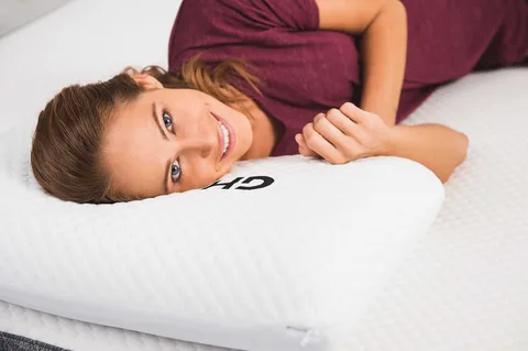 A serene image captures a girl in peaceful slumber on the FOAMO Adjustable Memory Foam Pillow.