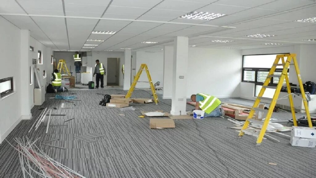 A professional flooring installation company at work in a home setting.